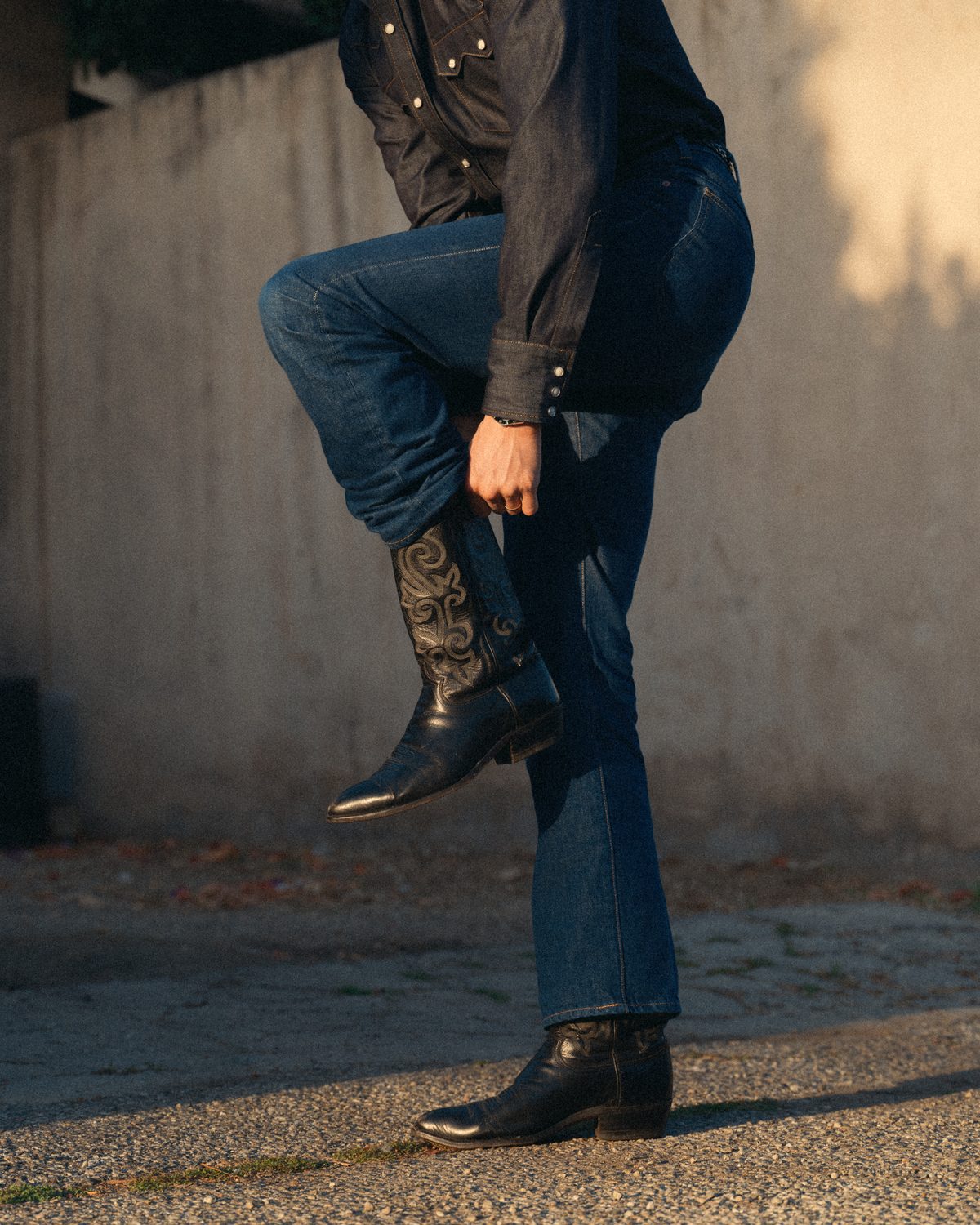 Cowboy jean over western boots