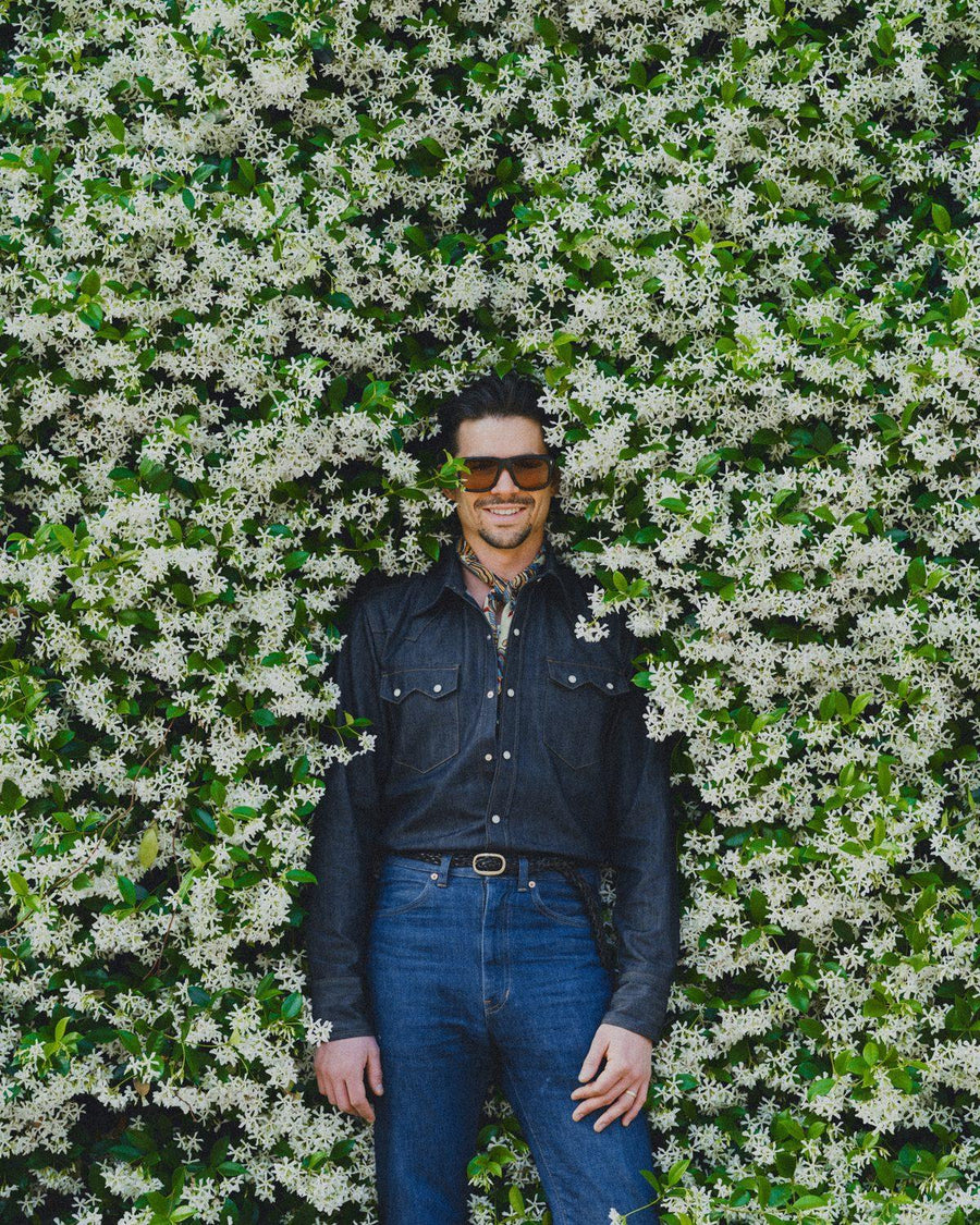 Full silhouette against jasmine wall
